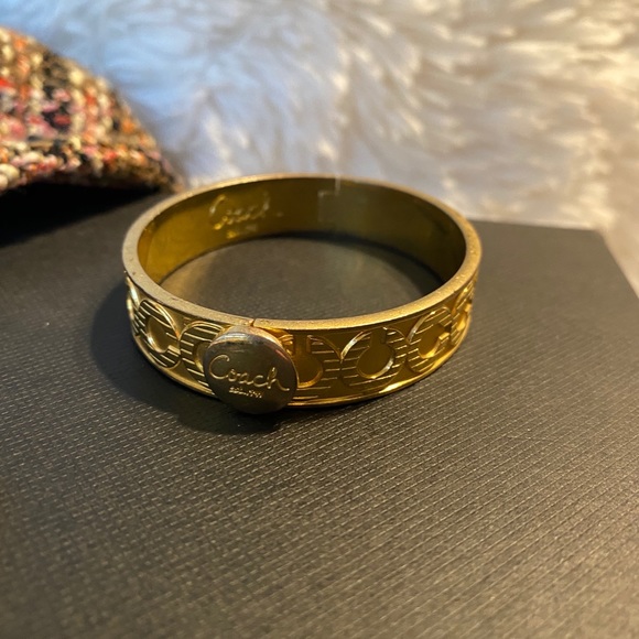 Coach Jewelry - Gold tone Bangle with closer clip Coach LOGO 😍